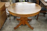 Round oak pedestal table.  42"