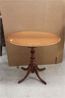 Walnut oval pedestal table.  30"