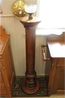 Early wooden pedestal with candle holder.  49"