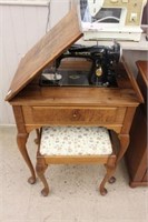 Singer cabinet sewing machine with bench