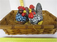 Ceramic roosters in a basket