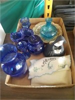 flat of blue glassware and hankies