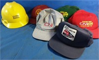 Several CN hats and CN rail hardhat