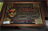 mirrored coca cola advertising sign