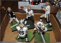 5 new orleans saints figures on stands