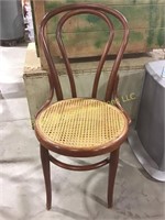 About 3ft tall wooden chair with cane seat