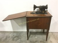 Singer sewing machine and 29" tall sewing table