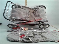 Antique baby buggy with sun shade umbrellas and