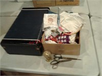 Vintage blue suitcase, knitting and sewing items,