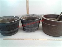 3 plastic planter barrels with holes in bottom