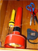 Flashlight, scissors, tape measure - contents of