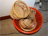 Assorted wicker baskets and plastic launddry