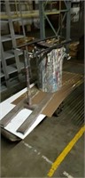 Heavy duty rolling cart measures about 64" by 24"