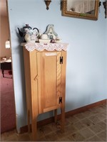 Wooden cabinet and contents.
