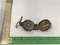 Bronze colored metal pocket compass with 2" diamet