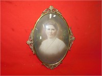 Vintage picture of woman with brass frame