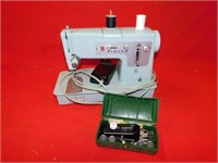 Singer sewing machine c/w some thread