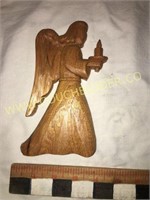 Handcarved wooden angel with candle