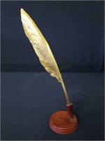 Brass feather quill with wood base