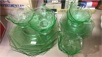 21 pieces of green glass, plates, cups & saucers,