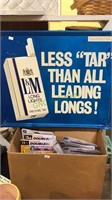 L&M tin cigarette sign, box of small lightbulbs