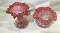 2 pink glass white dot ruffle edge vases, one