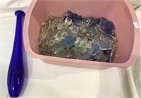 Tub filled with glass crystals, clear and blue
