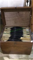 Antique wood box filled with old record albums,