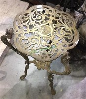 Small cast brass table, decorative legs and