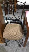 One tubular metal side chair with cushion seat,