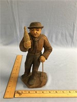 German carving c.1900 of a 10" man holding bottle