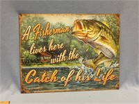 Tin sign: "Fisherman lives here with the catch of