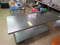 STAINLESS STEEL WORK TABLE HAS A DENT IN IT
