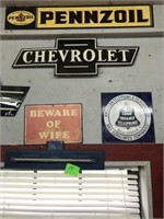 SIGN LOT, PENZOIL, CHEVY, BEWARE OF WIFE, PHONE