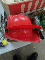 2 plastic fireman hats