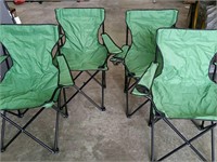 Four folding green chairs
