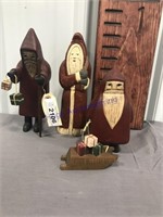 3 wooden santas