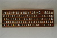 Collection of over 100 thimbles in hanging rack