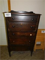 Antique chest of drawers on casters, one knob