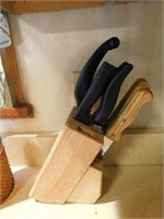 11 knives in wooden holder