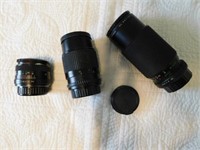 Three camera lenses: Rokinon Auto MC Zoom 200mm,