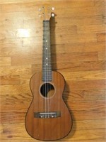 Small acoustic guitar, 4 string, 30" x 10" x 3"