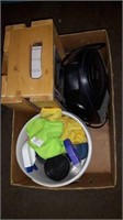 Box of cleaning supplies iron and bionaire