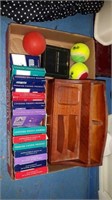 Box of cards and tennis balls