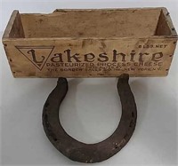 Wooden cheese box and horseshoe