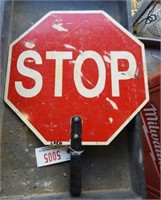 Traffic directors stop/slow hand held sign