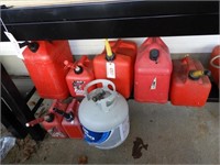 (7) Gas cans and (1) Propane canister