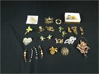 Collection of 24 pins / brooches
