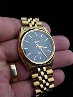 Goldtone Seiko watch with day and date