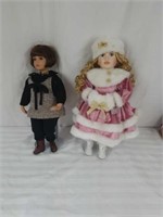 2 porcelain dolls with stands